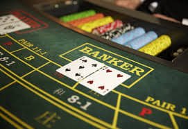 Filipino player reading a slot game paytable on a smartphone before spinning